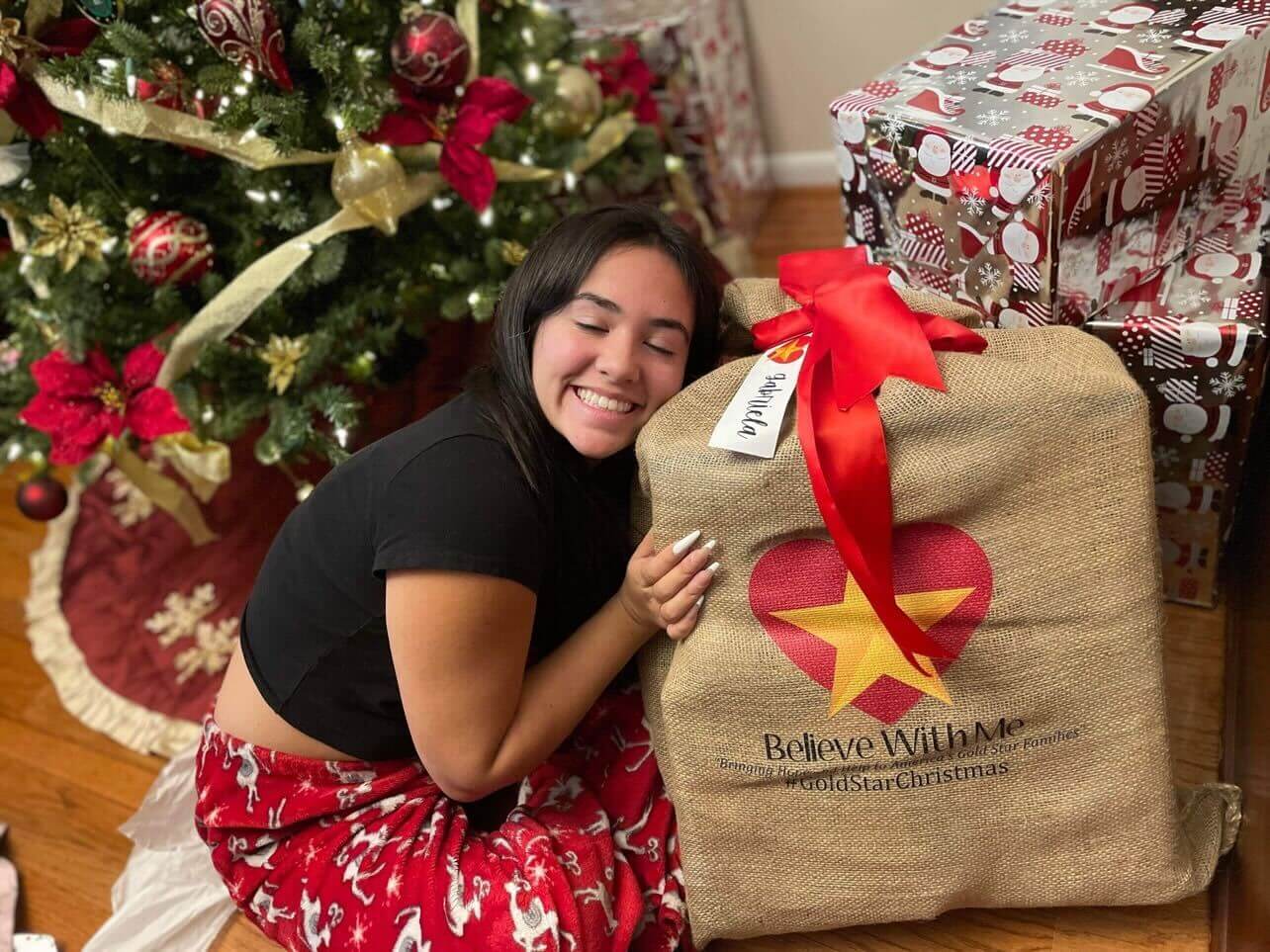 Young girl excited about her Christmas gift